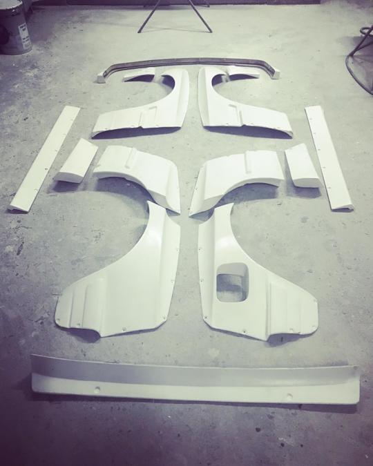 BMW E30 sedan Rocket Bunny Pandem-style body kit
