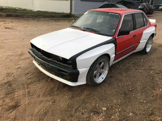 BMW E30 sedan Rocket Bunny Pandem-style body kit